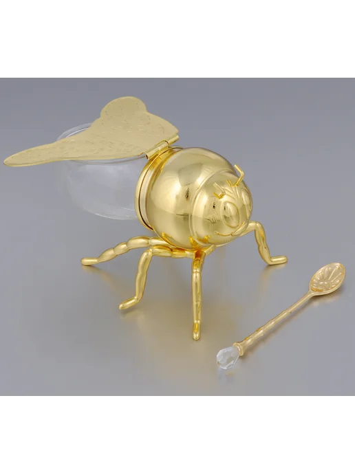 стеклянная банка меда с ложкой на деревянном столе